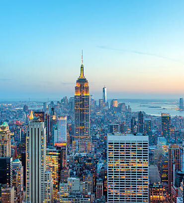 illuminated skyscrapers in Manhattan at evening with Empire State Building and Freedom Tower - the new World Trade Center, New York City